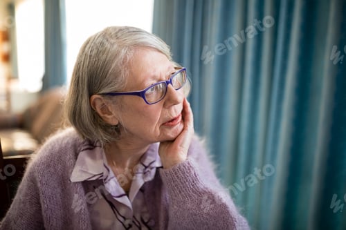 Preview: Thoughtful senior woman looking away