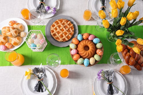 Preview: Festive Easter table setting with traditional meal, top view