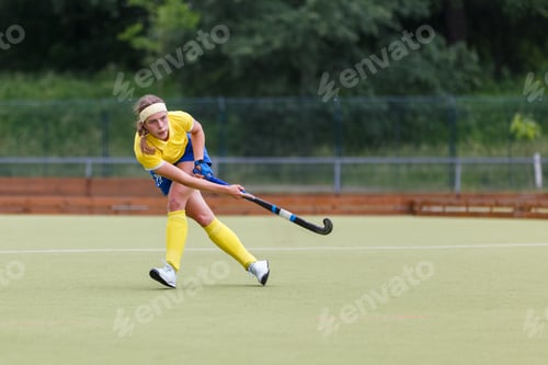 Preview: Field hockey player making pass to a teammate