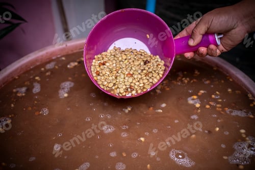 Preview: Coffee farmer or worker holding coffee beans on hands checks the quality of bean before take to roas