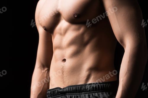 Preview: cropped shot of shirtless muscular man standing isolated on black
