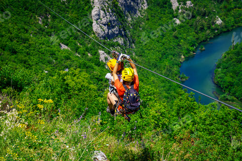 Preview: Women Enjoying Thrilling Zipline Experience, Embracing the Exhilaration of Activity-filled Vacation