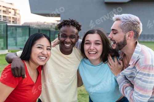 Preview: Young diverse group of friends having fun outside - Happy gen z people hugging outdoor