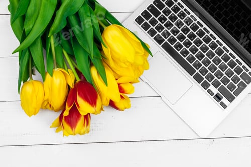 Preview: Easter eggs, mockup laptop and bouquet of tulips