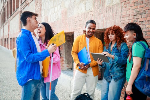 Preview: Diverse group of students have fun after class in high school. Friends, university and youth life