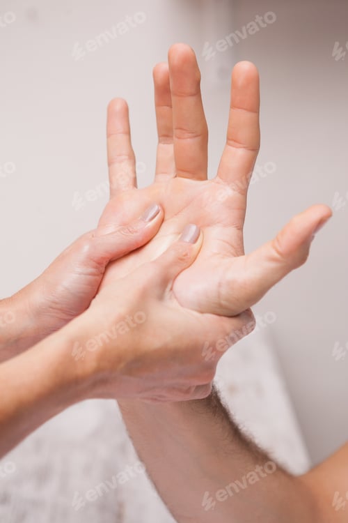 Preview: Manicurist massaging a customers hand in a salon