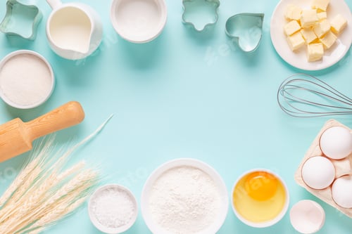 Preview: Ingredients for baking on light blue background.