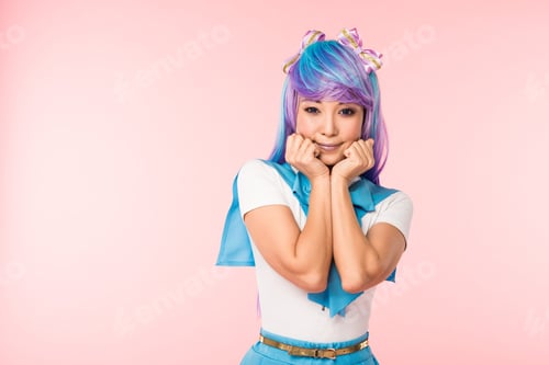 Preview: Pretty asian anime girl in purple wig posing isolated on pink