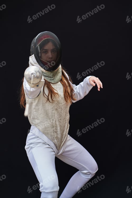 Preview: Portrait of woman dressed in fencing costume on black background