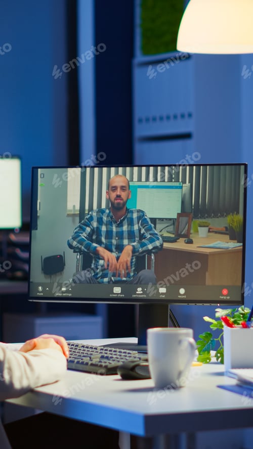 Preview: Businesswoman having corporate meeting with remotely paralyzed man