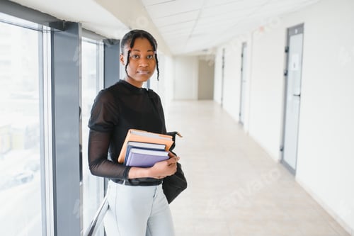 Preview: portrait of happy female african american college student