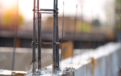 Preview: Concrete footings and reinforcing steel rods at a construction site. Groundwork for new building