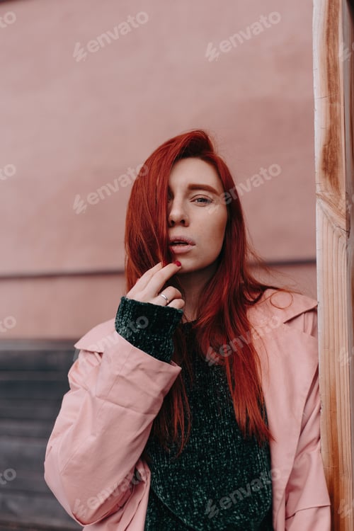 Preview: Beautiful And Stylish Girl With Red Hair Walks In The City And Her Hair Is In The Wind