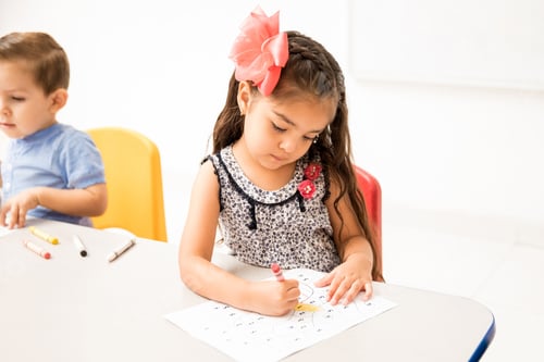 Young Students Learning to Color at School