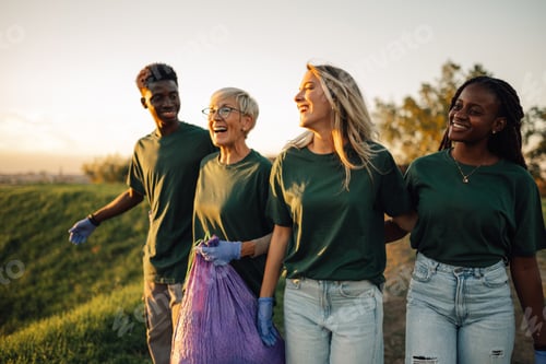 Preview: Group of volunteers collecting garbage in park are walking and talking