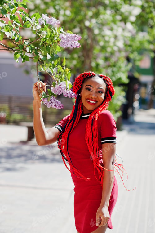 Preview: African american girl in red dress with dreadlocks