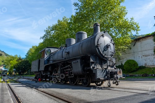 Preview: A black train is sitting on the tracks