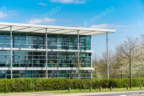 Preview: glass office building. green city.