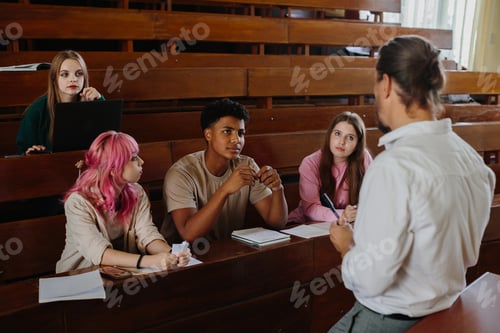 Preview: Students Engaged in Classroom Discussion with a Teacher in a Lecture Hall