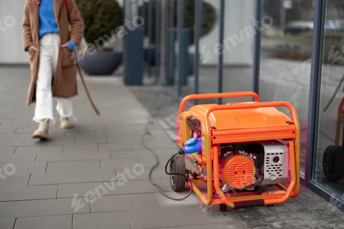 Preview: Electric generator on a street near shop or cafe