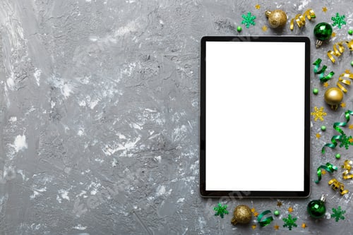 Preview: Christmas online shopping from home tablet pc with blank white display top view.
