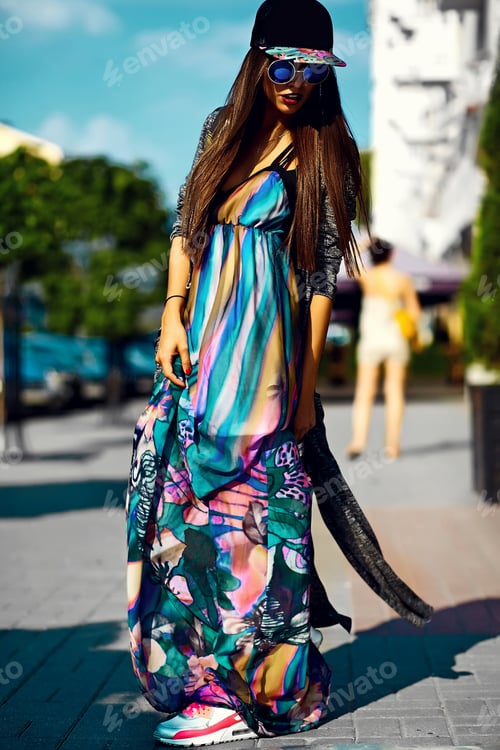 Preview: Portrait of young stylish woman posing outdoors