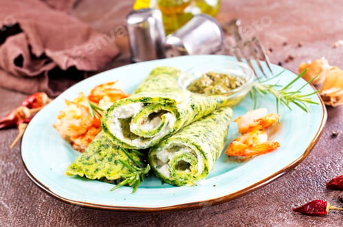 Preview: Green pancakes close-up with shrimps stuffing and cheese