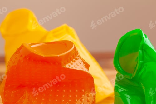 Preview: Plastic objects, recycle garbage on a wooden background