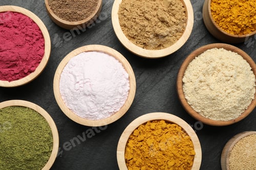 Preview: Different superfood powders on black table, flat lay