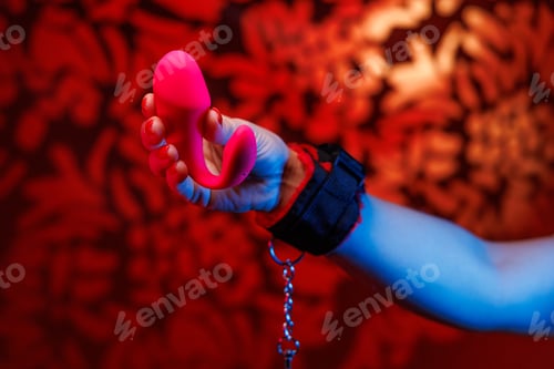 Preview: A delicate pink vibrator is presented with grace in feminine hands