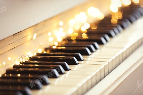 Preview: Glowing fairy lights on piano keys, closeup. Christmas music