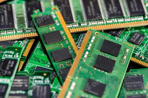 Preview: A stack of old SDRAM memory modules lying on a printed circuit board.
