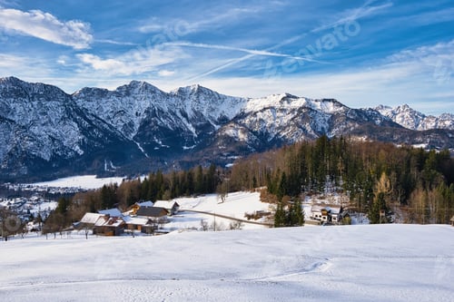 Preview: Snow-covered hill with towering mountains in the World Heritage region of Hallstatt Dachstein