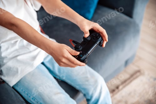 Preview: Gamer holding gamepad, controller or videogame joystick console in hands