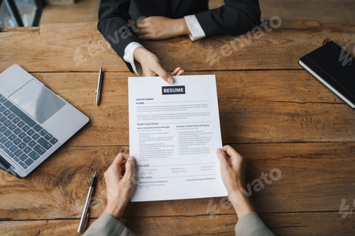 Preview: Close-up of business owner check resume of job applicants in company at the office.