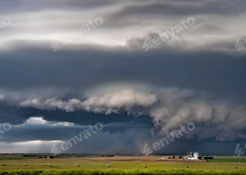 Preview: Dark storm clouds over farmland