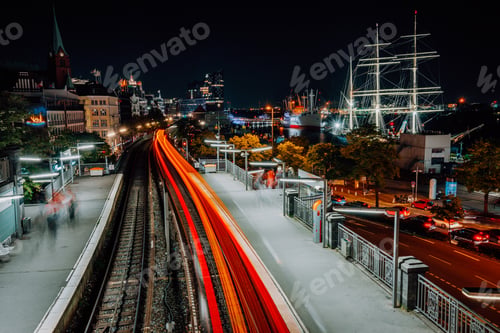 Preview: Urban Hamburg cityscape of Harbor and metro station near Landungsbruecken at night