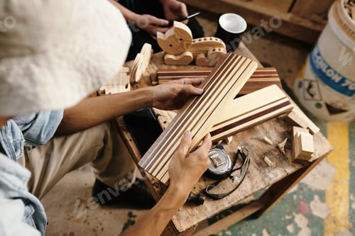Preview: Carpenters discussing striped plank