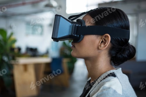 Preview: Businesswoman using virtual reality headset