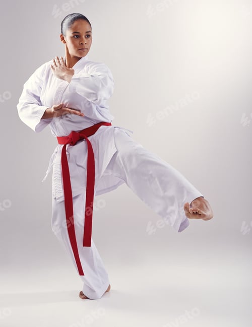 Preview: Shes got a solid kick. Shot of a young woman doing karate.