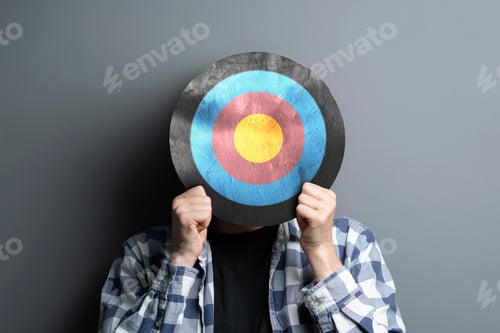 Preview: a person holding target in front of head, internet sales targeting concept