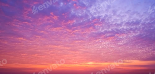 Preview: Dramatic sunrise sky with majestic colorful sunlight and fluffy clouds on twilight sky at morning