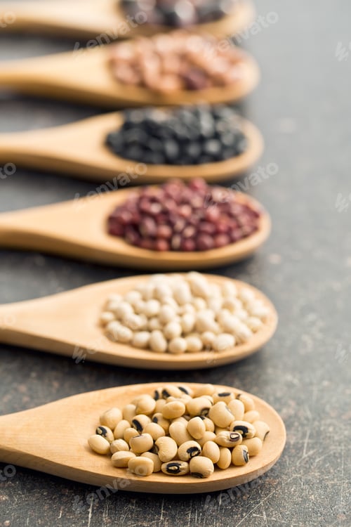 Preview: various legumes in wooden spoons