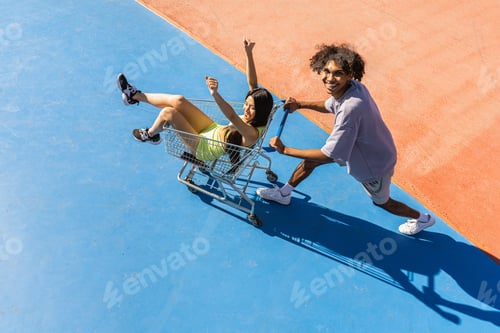 Preview: Multiracial group of young friends bonding outdoors