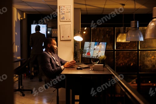 Preview: Businessman explaining marketing strategy to remote team