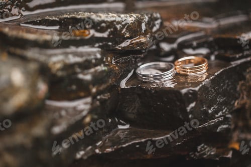 Preview: Wedding rings on water surface texture