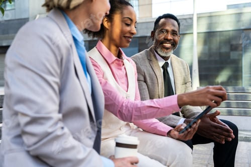 Preview: Group of multiethnic business people meeting outdoors