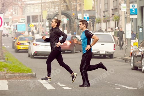 Preview: Young man and woman running across city road