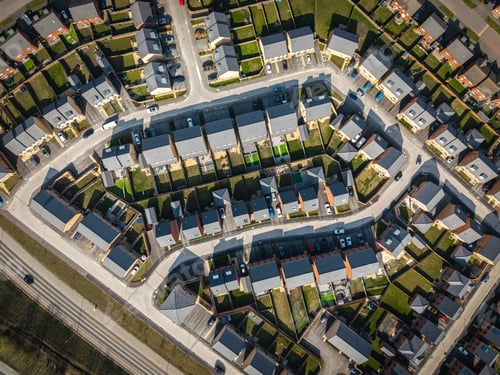 Preview: Aerial view directly above a new build housing estate in the UK