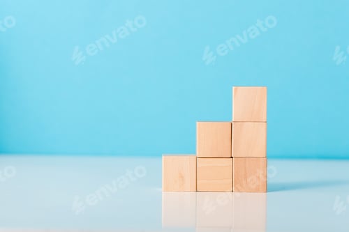 Preview: wooden cubes on blue with copy space
